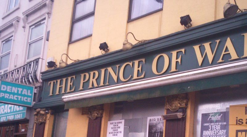 Prince of Wales pub sign with Paddy Power in the background